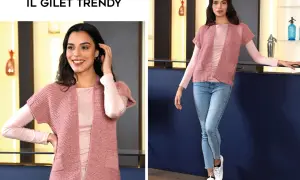Modelli gilet ai ferri donna: un capo rosa cipria con maniche corte, perfetto per un look casual chic.