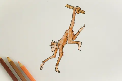 A simple drawing of a monkey hanging from a branch, with colored pencils in the corner.