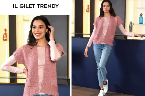 Modelli gilet ai ferri donna: un capo rosa cipria con maniche corte, perfetto per un look casual chic.
